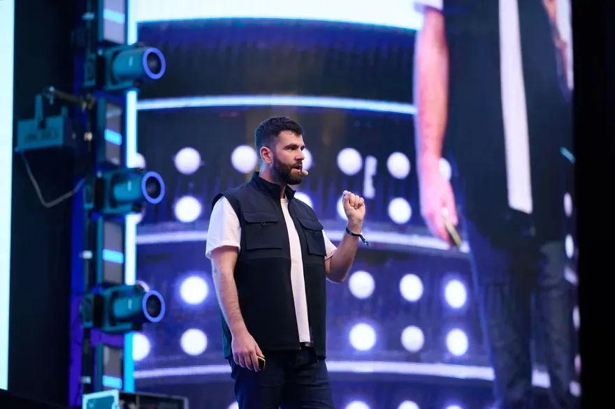 Aggelos Mouzakitis speaking on stage